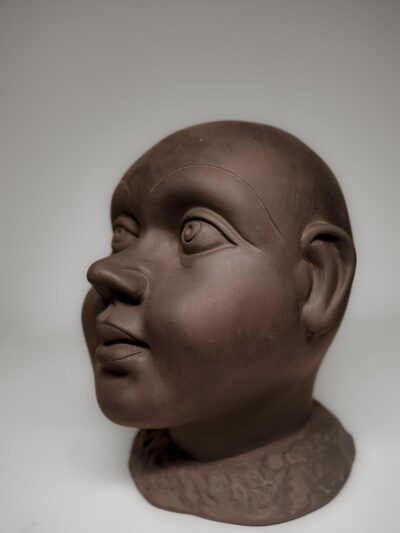 Ethnic Black Terracotta Baby Face Sculpture – Handmade Accent